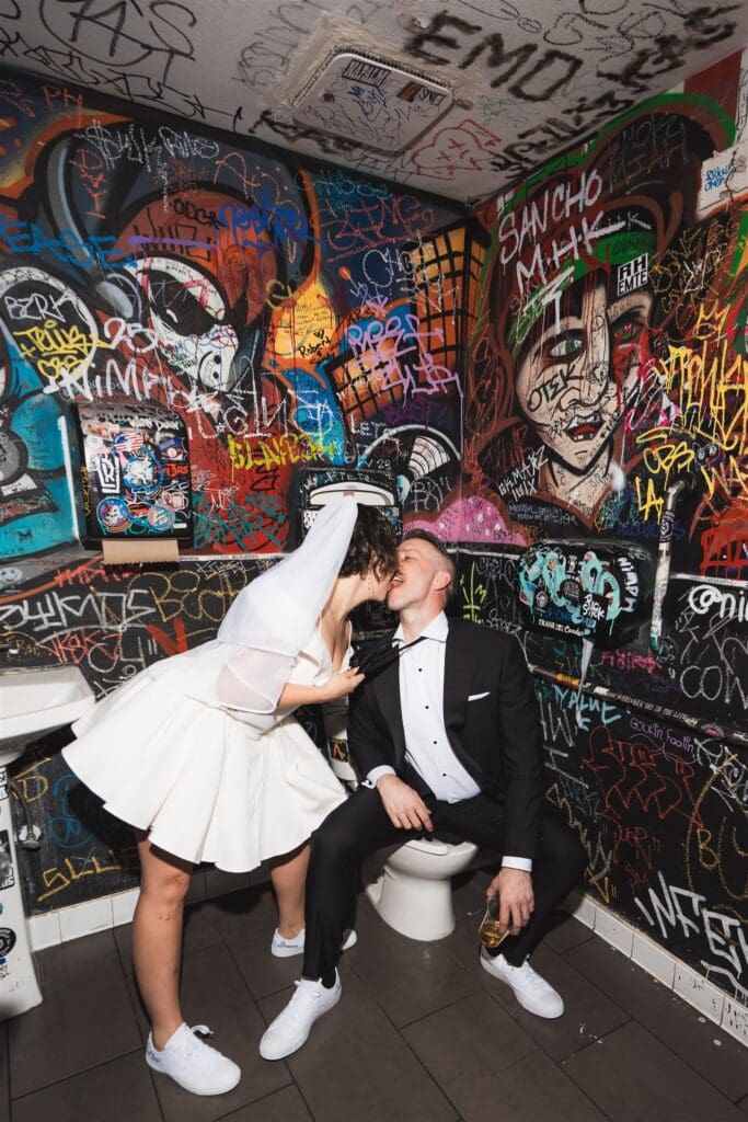 cute picture of the bride and groom kissing during their photoshoot