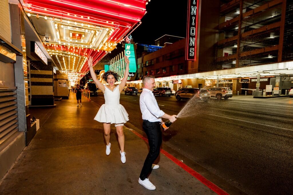 couple celebrating their elopement with champagne
