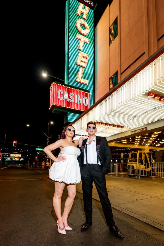 Bride and groom, smiling at the camera during their photoshoot