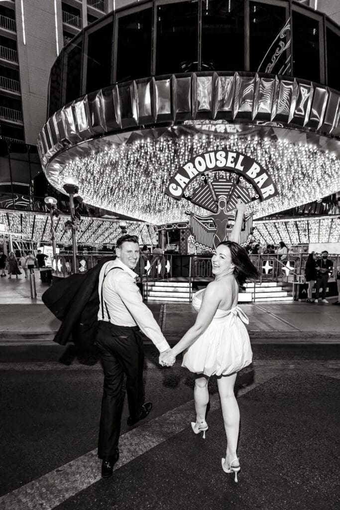 Bride and groom laughing with each other during their photoshoot