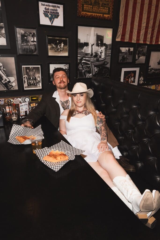 couple smiling at the camera during their photoshoot
