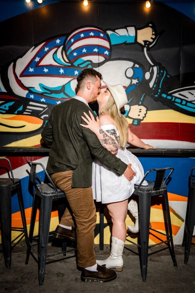 portrait of the newlyweds kisssing