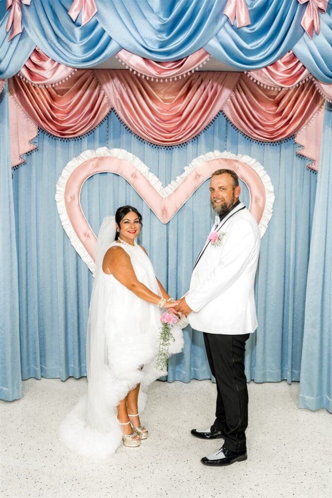 bride and groom holding hands during their wedding ceremony