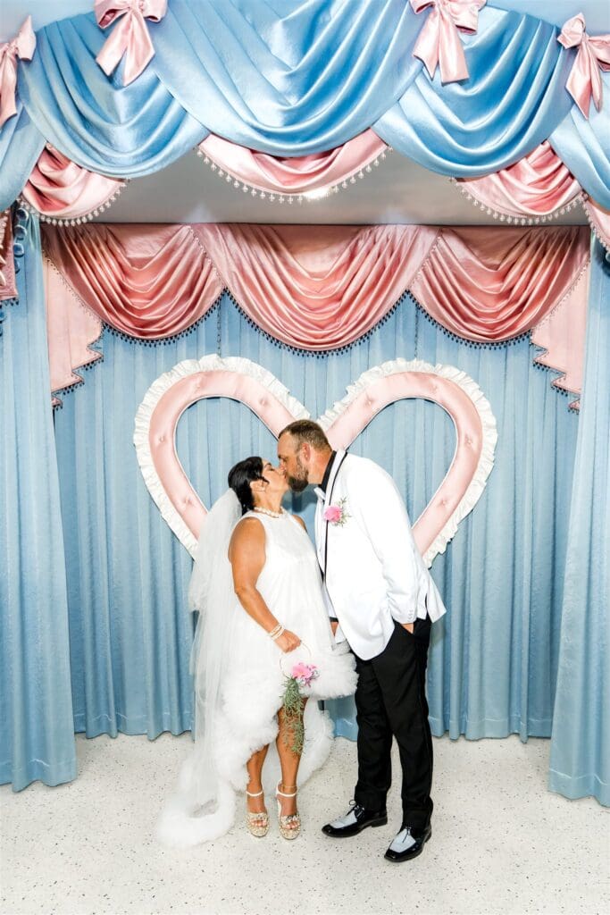 Cute portrait of the newly married couple kissing
