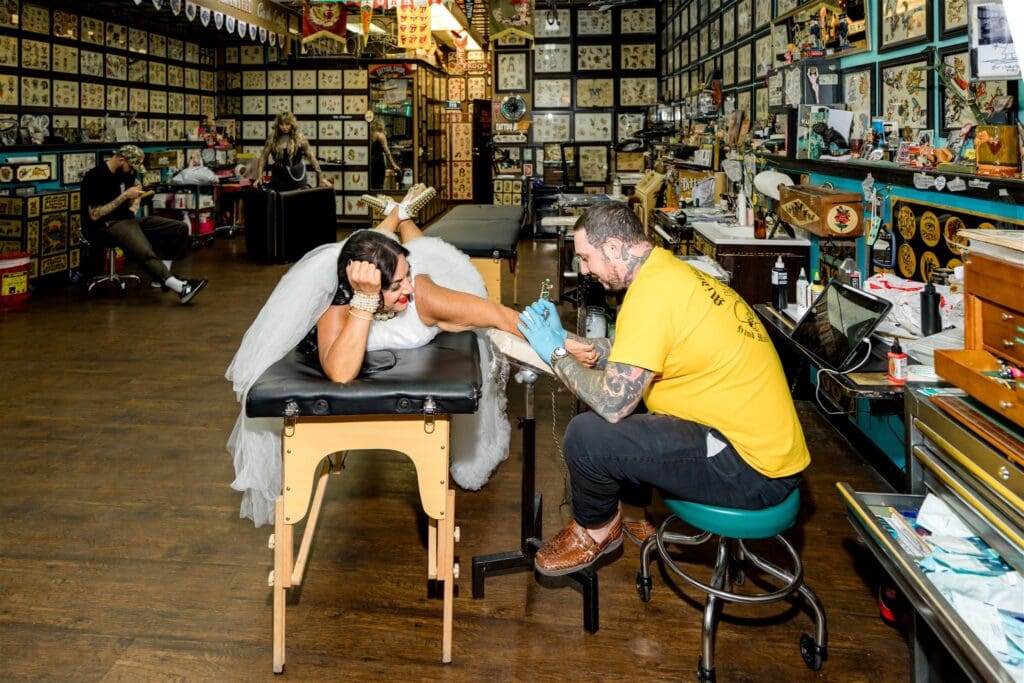 newlyweds getting tattoos after their elopement ceremony