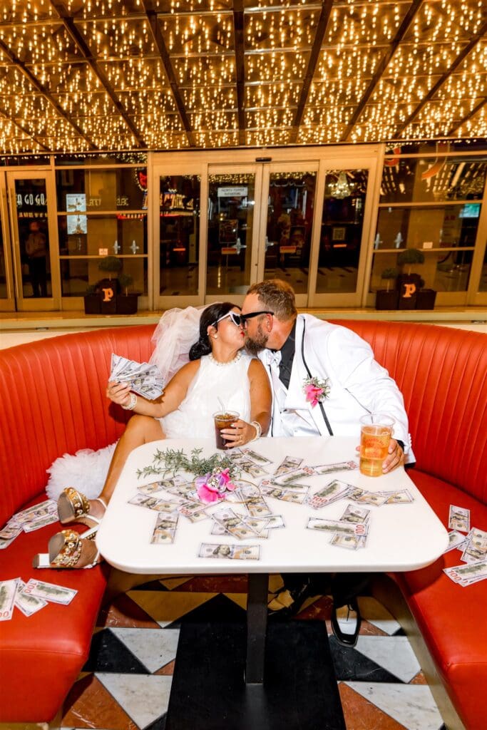 cute picture of the newly married couple kissing 