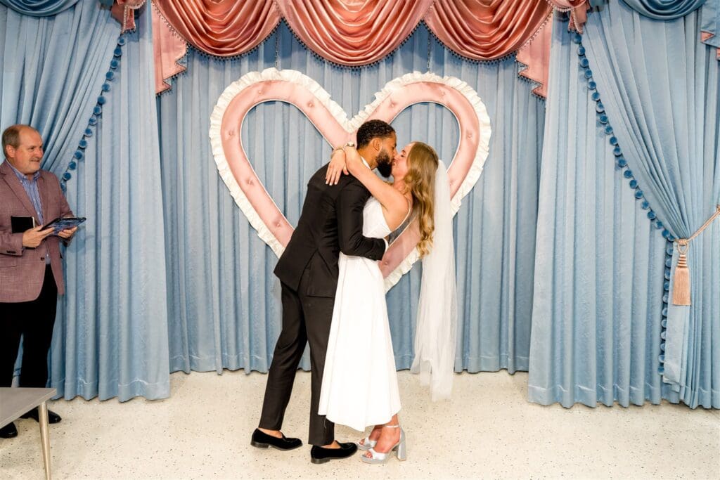 Bride and groom, kissing after their elopement ceremony