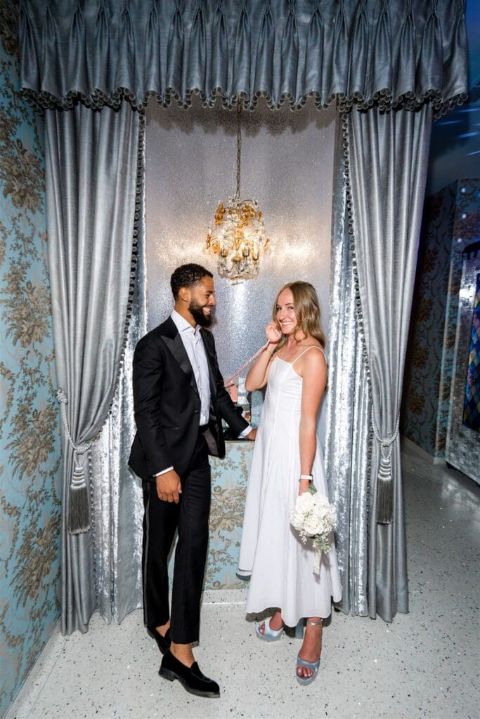 Bride and groom smiling at each other