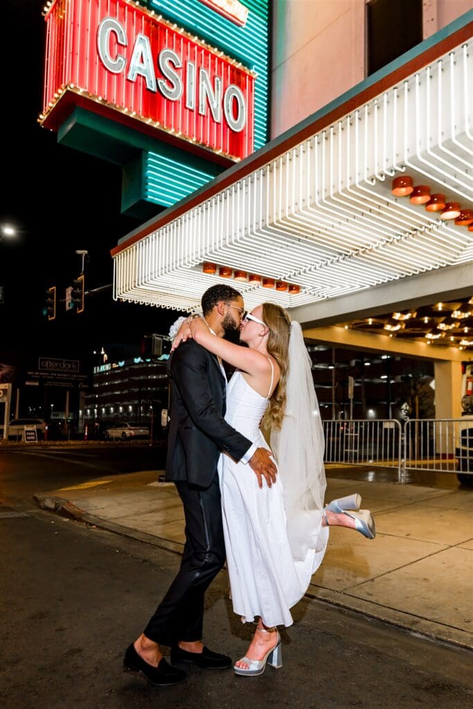Couple celebrating their elopement at downtown Fremont Street