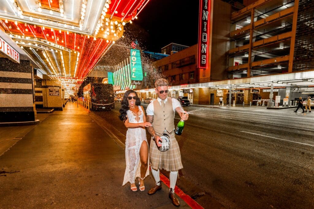 couple celebrating their elopement with champagne