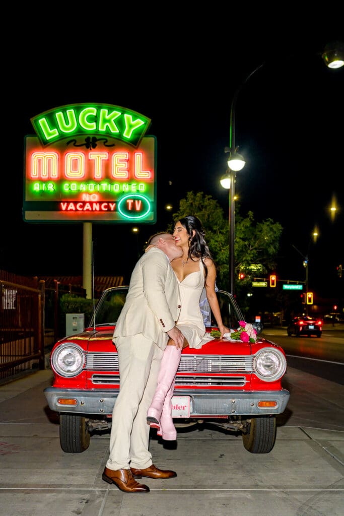 Groom, kissing the bride on the cheek