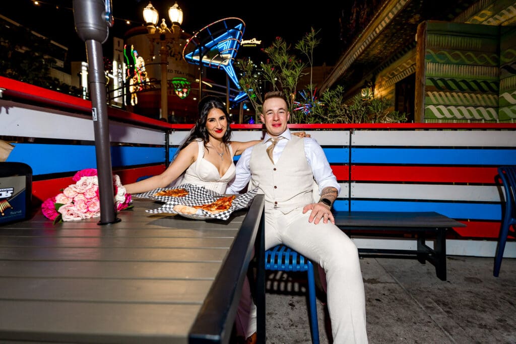 Couple having pizza after their ceremony