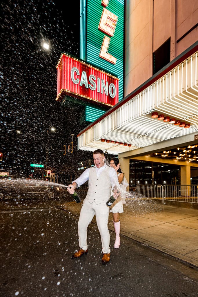 Couple celebrating their elopement with champagne