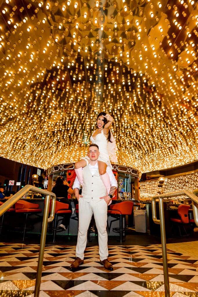 Newly married couple having the best time in downtown Las Vegas