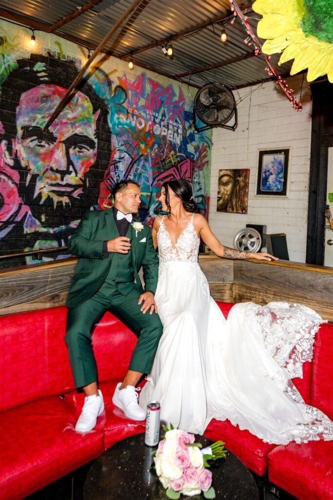 portrait of the bride and groom laughing with each other during their bridal portraits