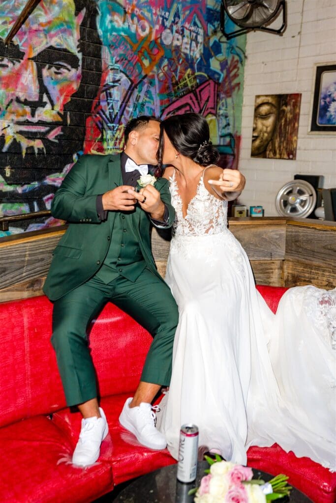 portrait of the bride and groom showing their wedding rings