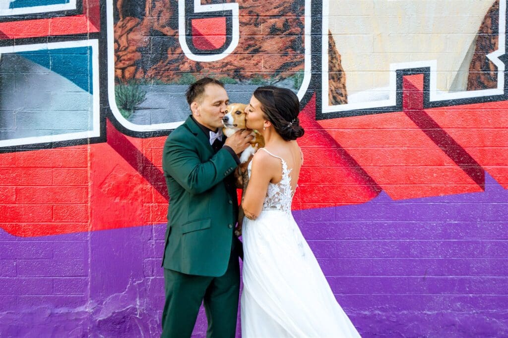 cute picture of the bride and groom with their dog