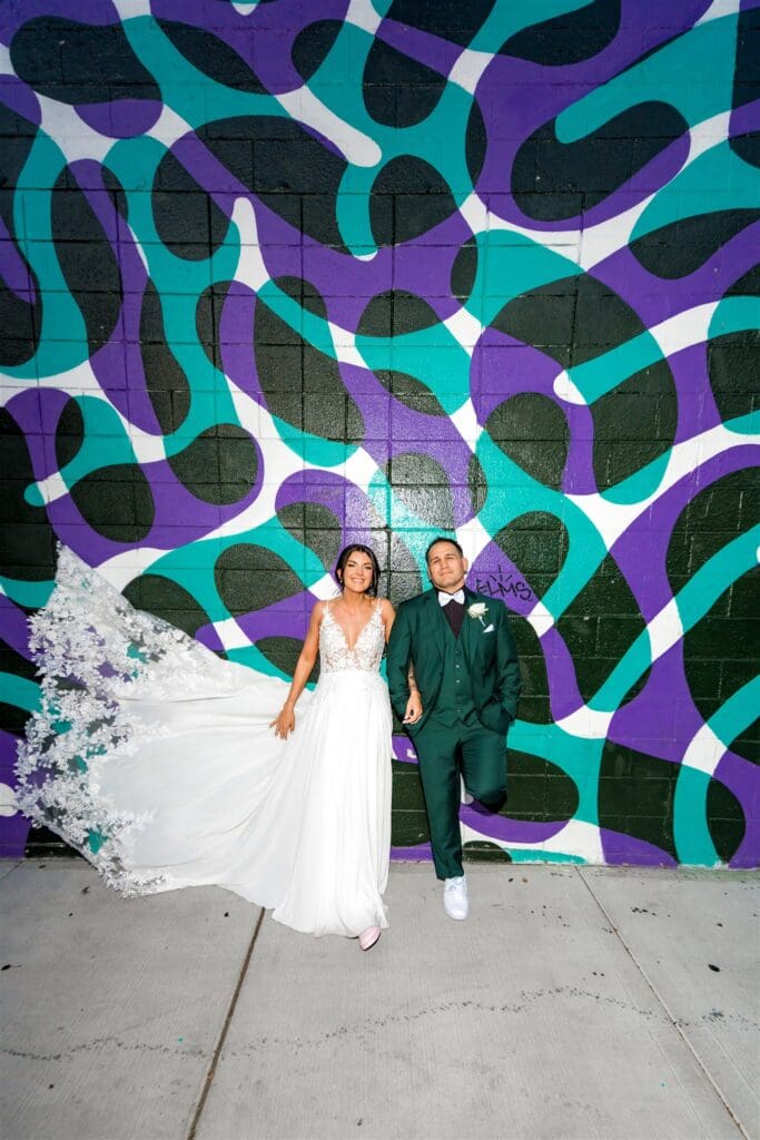 picture of the bride and groom holding hands