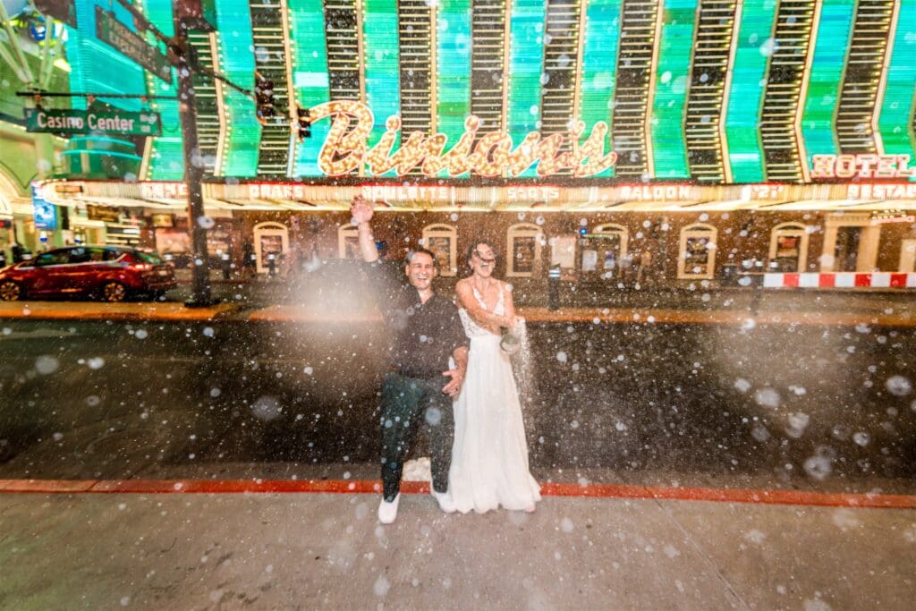 couple celebrating their elopement with champagne
