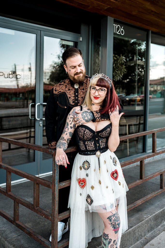 newlyweds smiling at the camera during their session