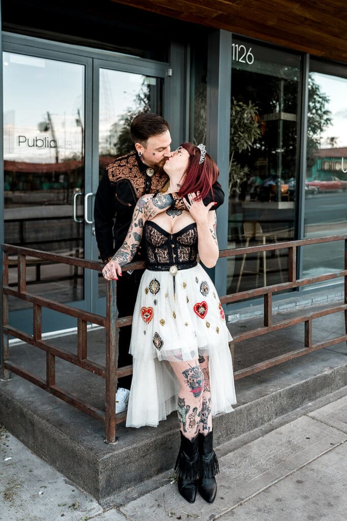 portrait of the newlyweds kissing during their photoshoot