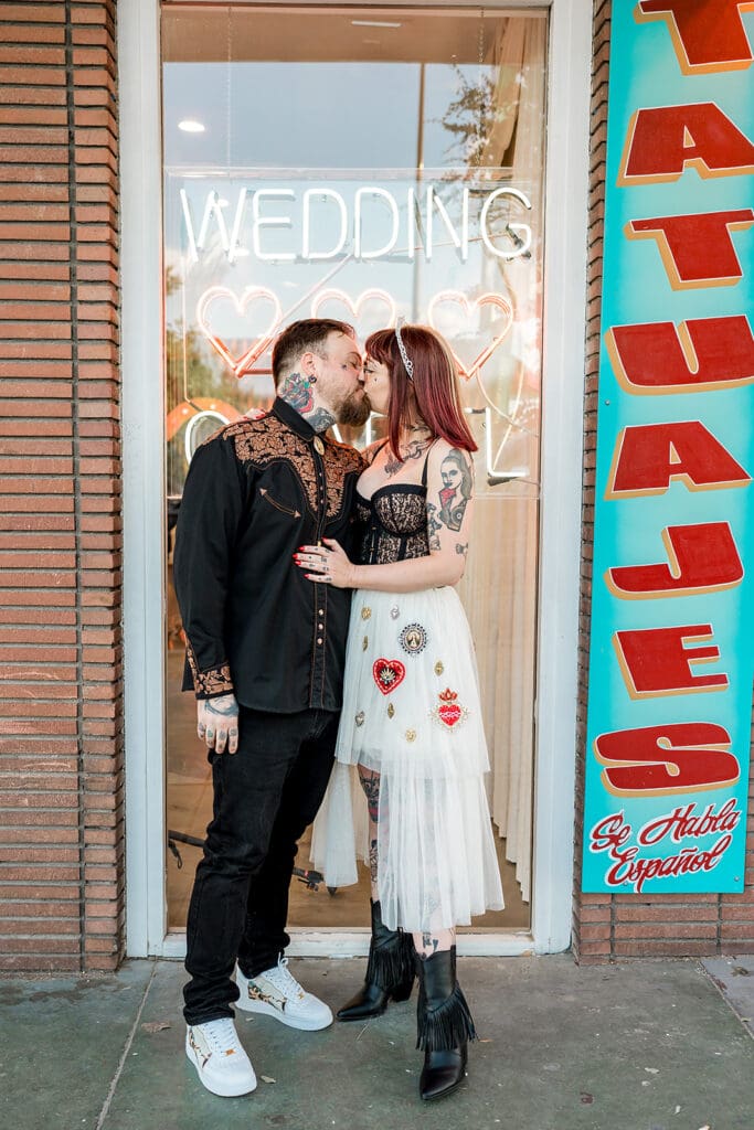 picture of the bride and groom kissing before the ceremony
