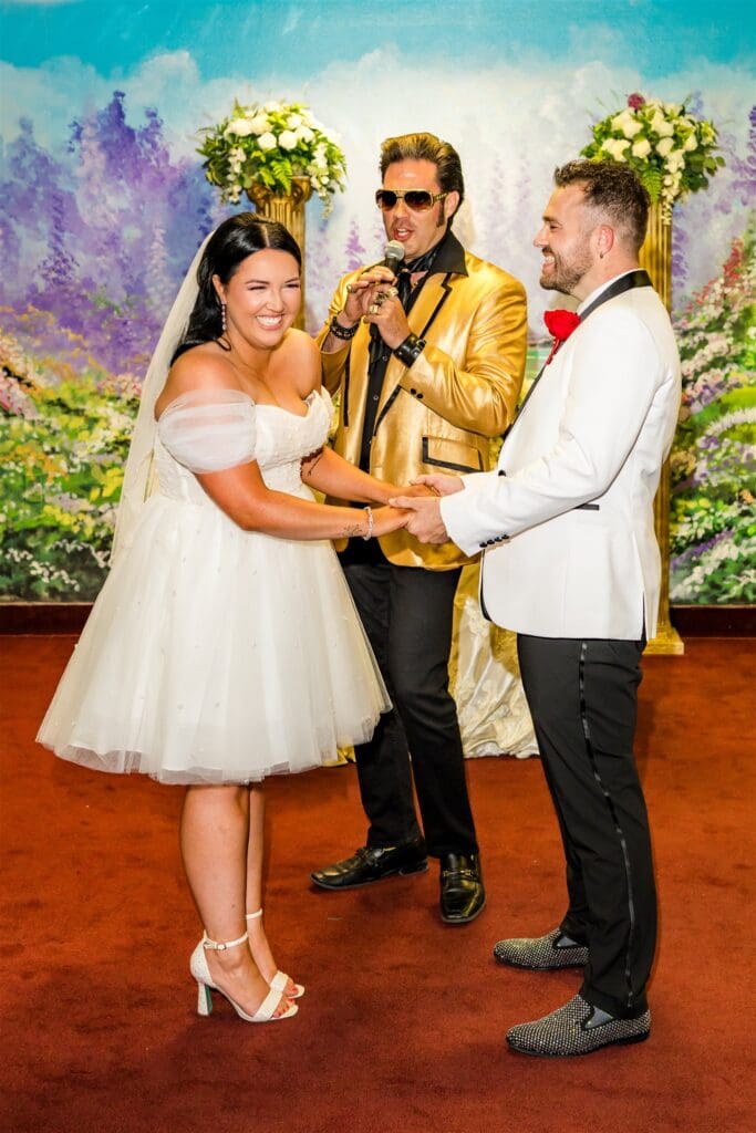 Bride and groom holding hands during their ceremony