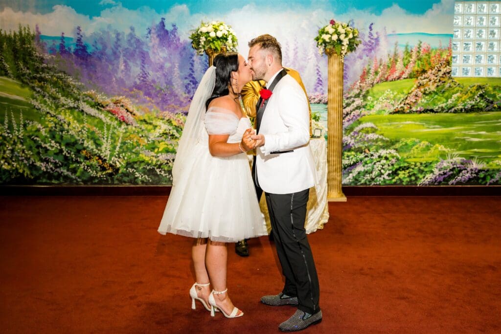 Bride and groom, kissing after the ceremony
