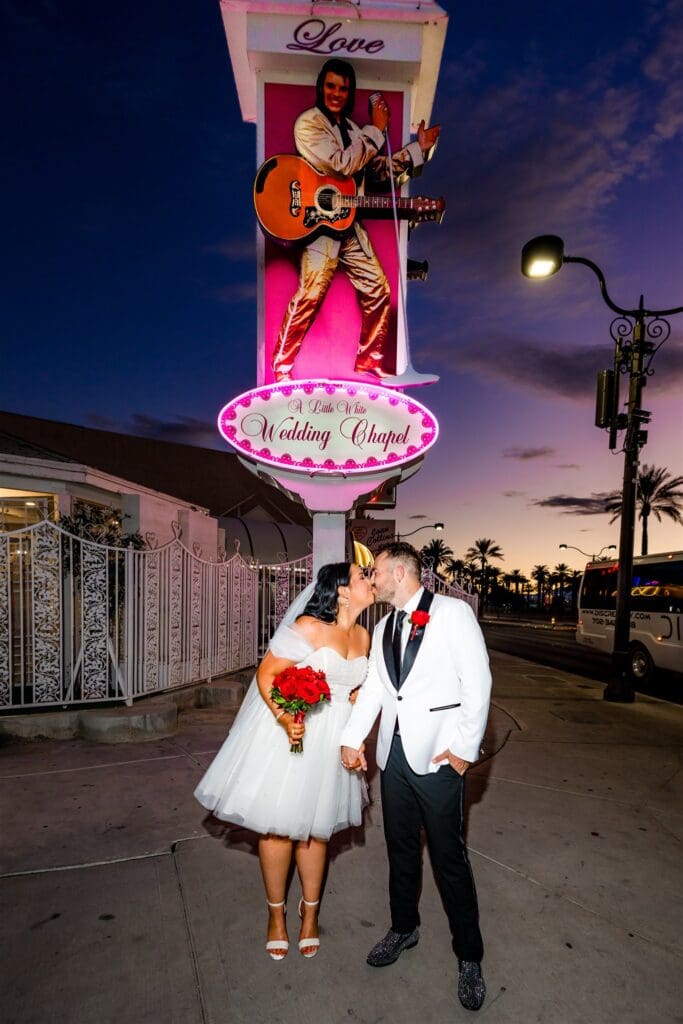 Portrait of the newly married couple kissing