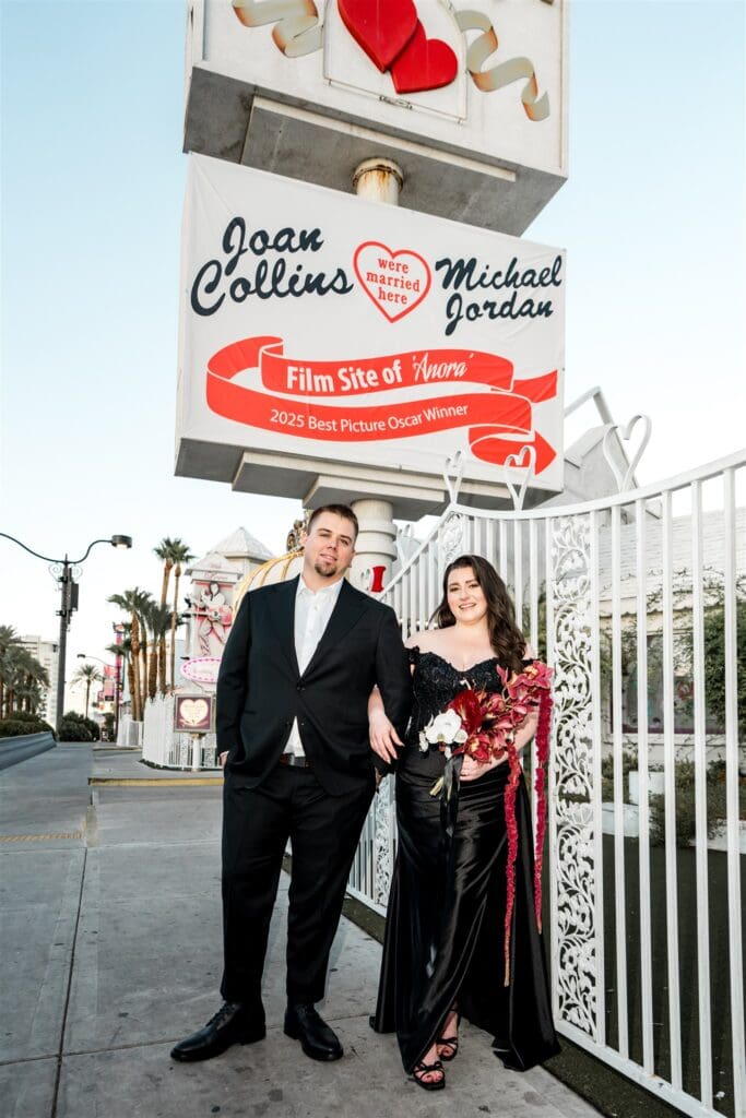 newlyweds smiling at the camera during their bridal portraits
