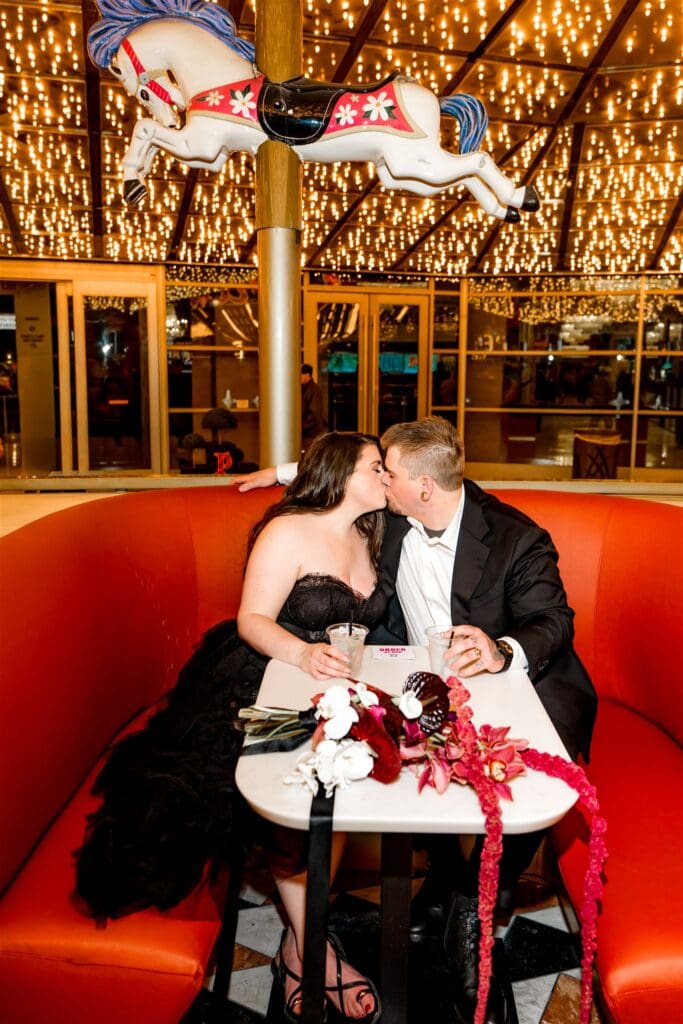 cute picture of the couple celebrating their elopement with drinks