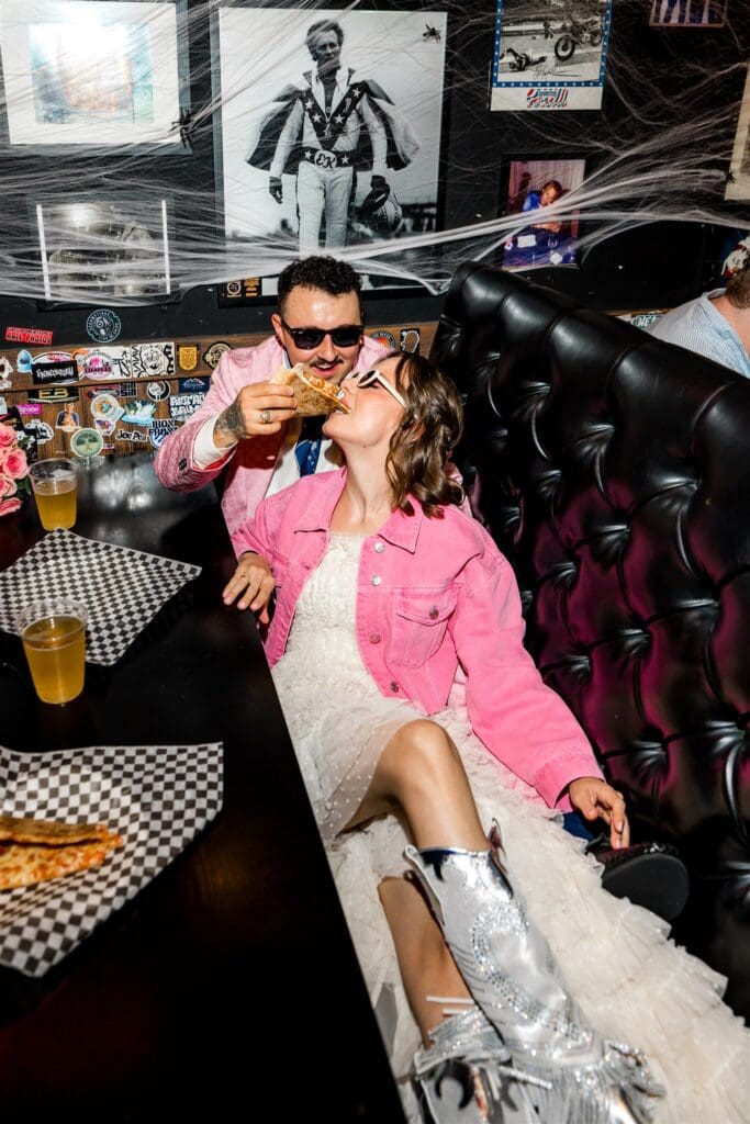 couple having pizza in DTLV after their ceremony
