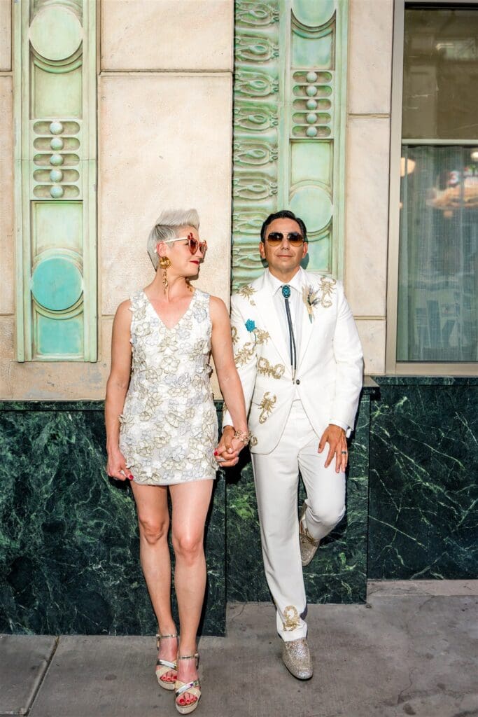 portrait of the newlyweds holding hands