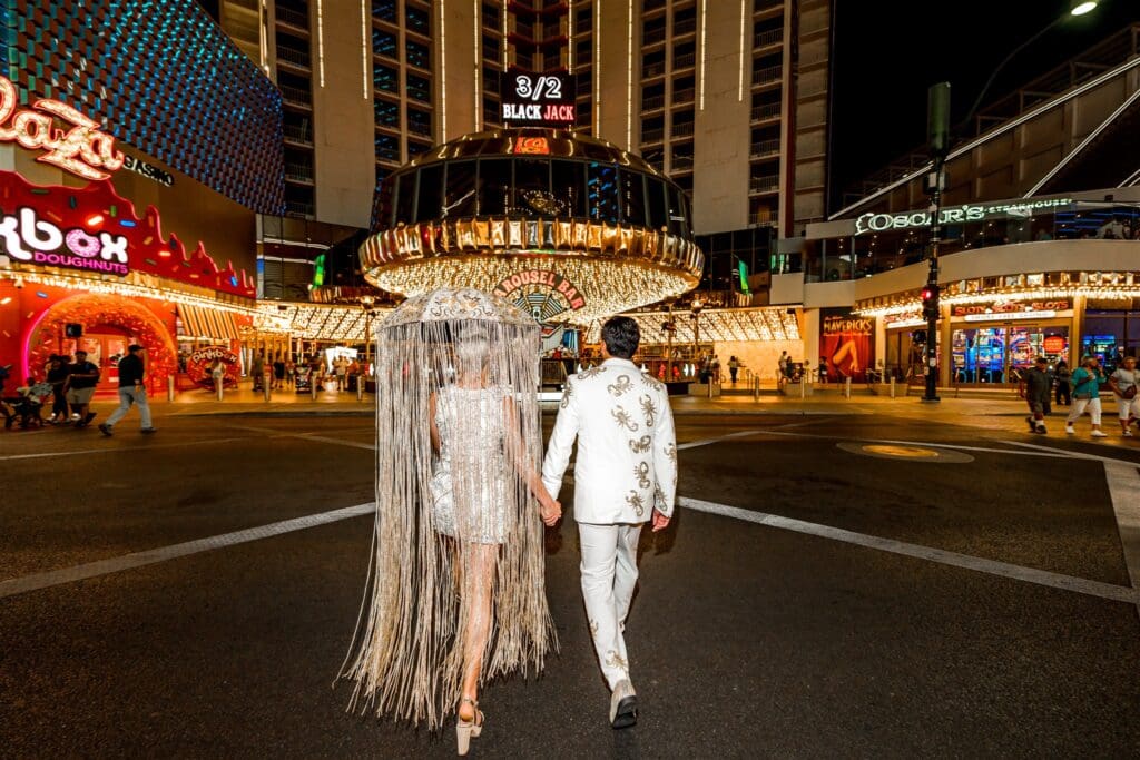 couple walking around fremont street during their session