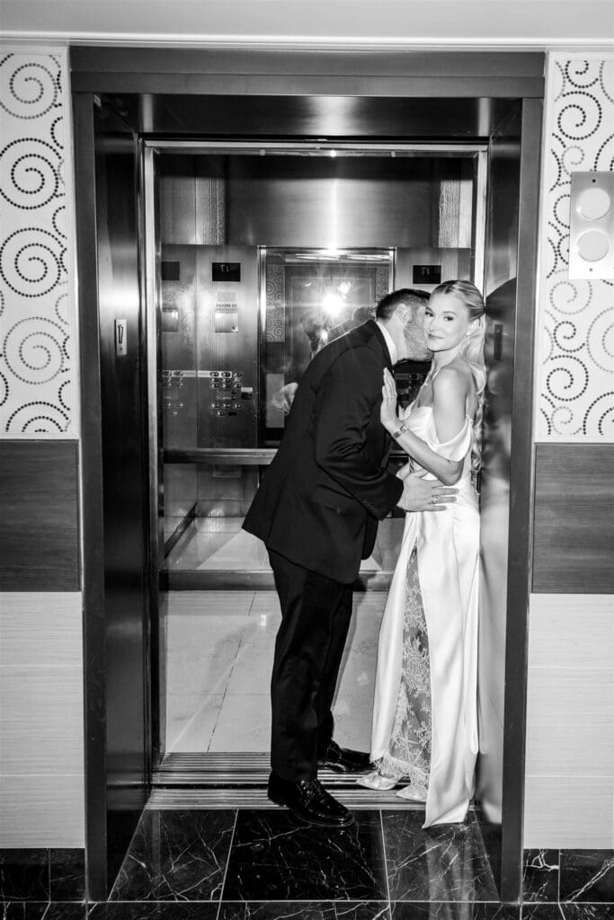 groom kissing the bride on the cheek