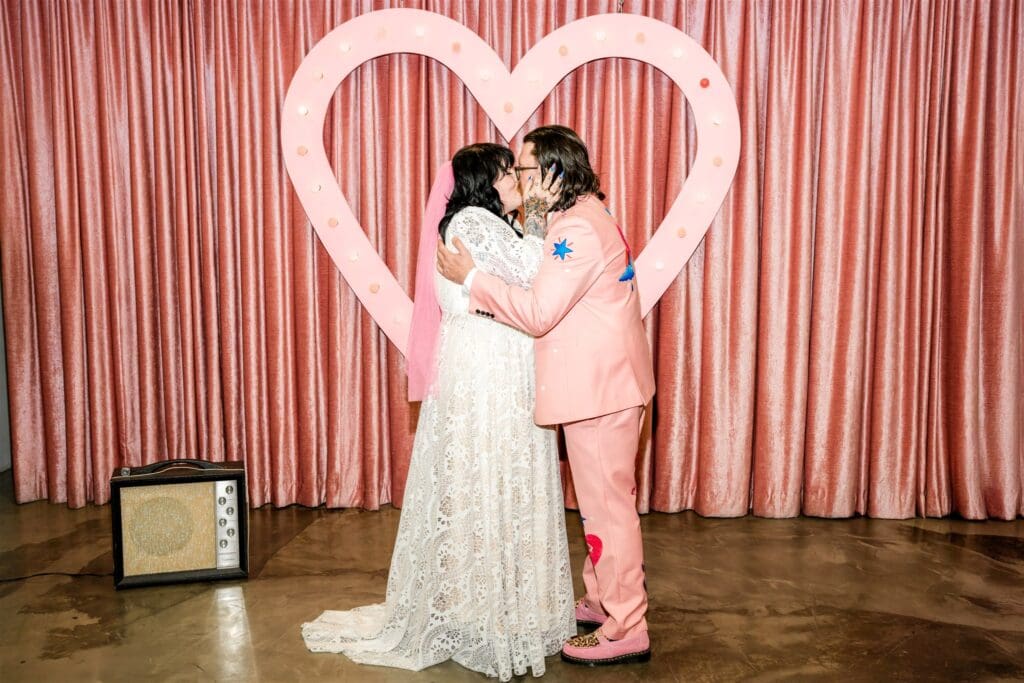 bride and groom kissing after their ceremony