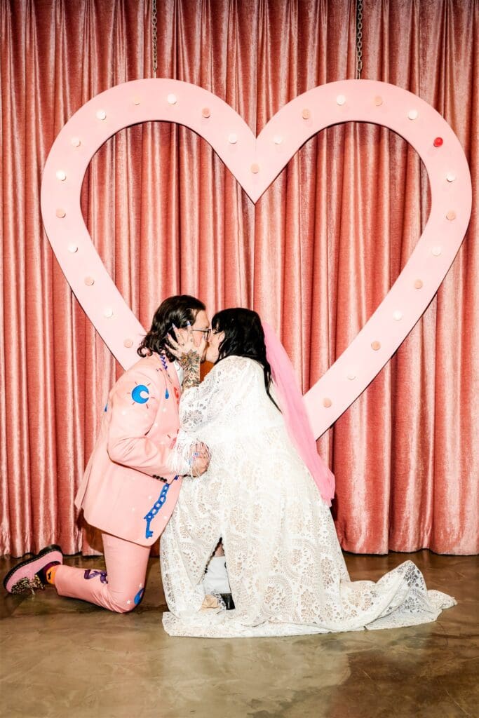 portrait of the bride and groom kissing after their ceremony