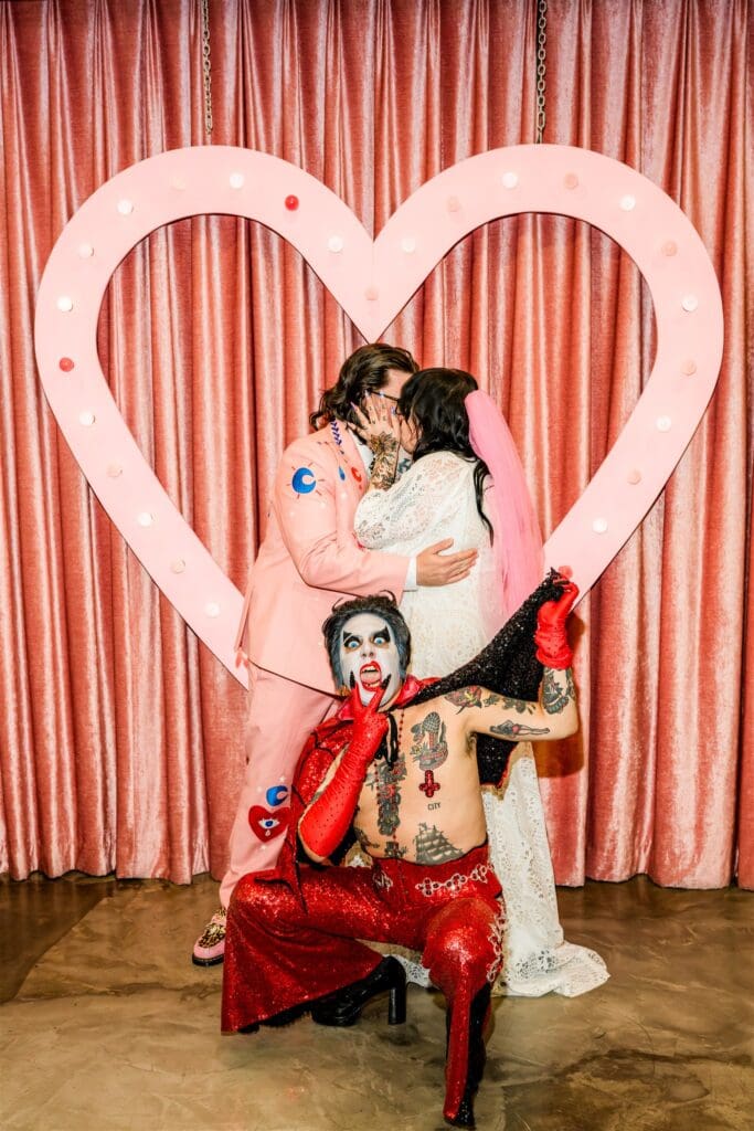 picture of the newly married couple kissing 