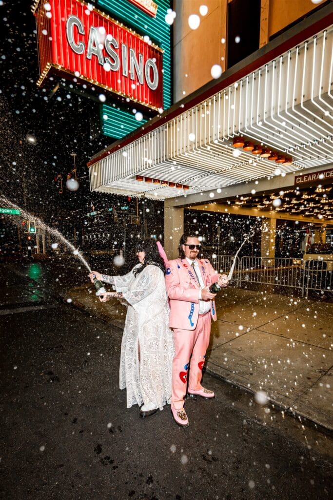bride and groom celebrating their elopement with champagne