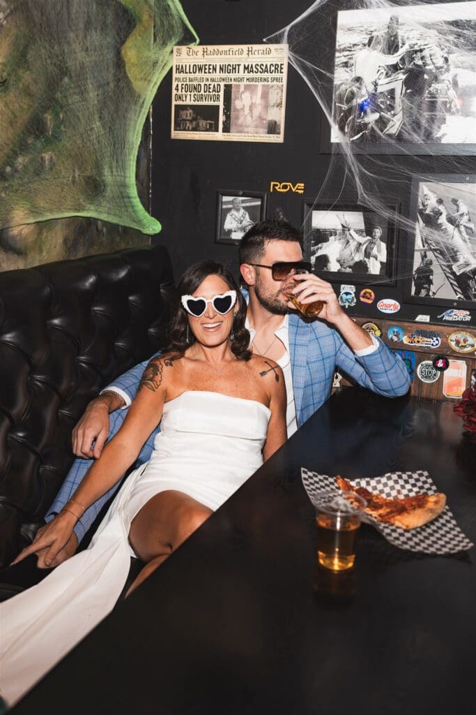 bride and groom having pizza before their ceremony