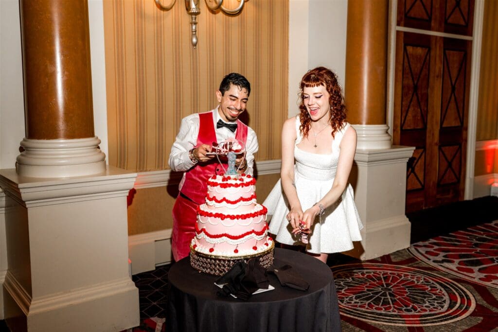 cute picture of the couple cutting their wedding cake
