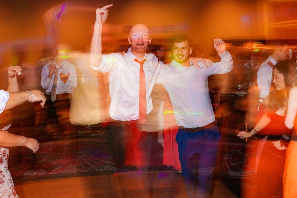 wedding guests dancing at the wedding reception
