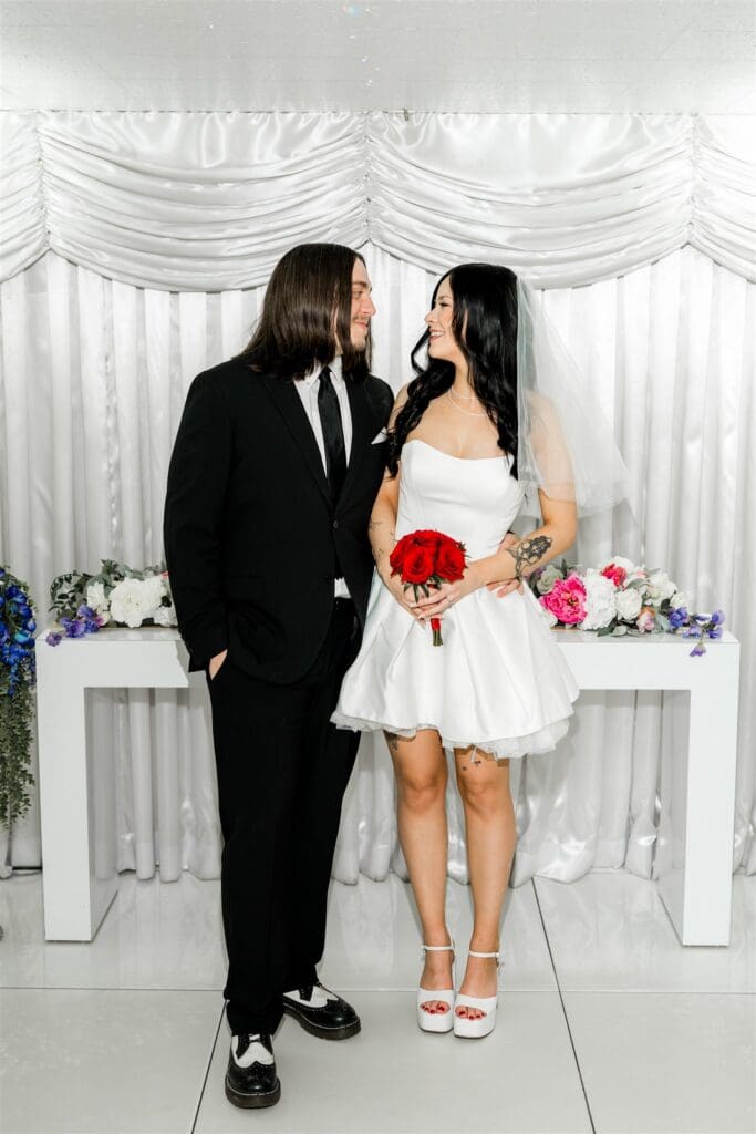 cute picture of the newlyweds smiling at each other