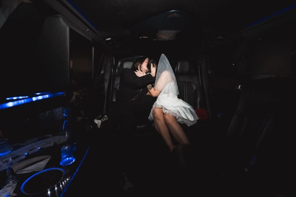 portrait of the newlyweds kissing during their photoshoot