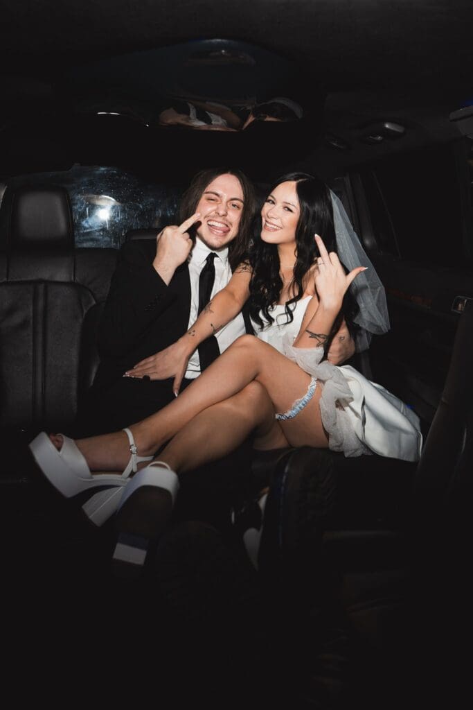portrait of the newlyweds showing their wedding rings