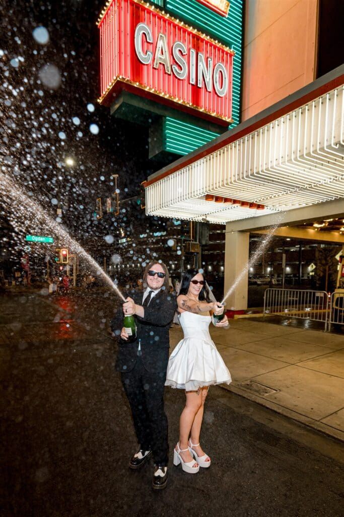 couple celebrating their elopement with champagne