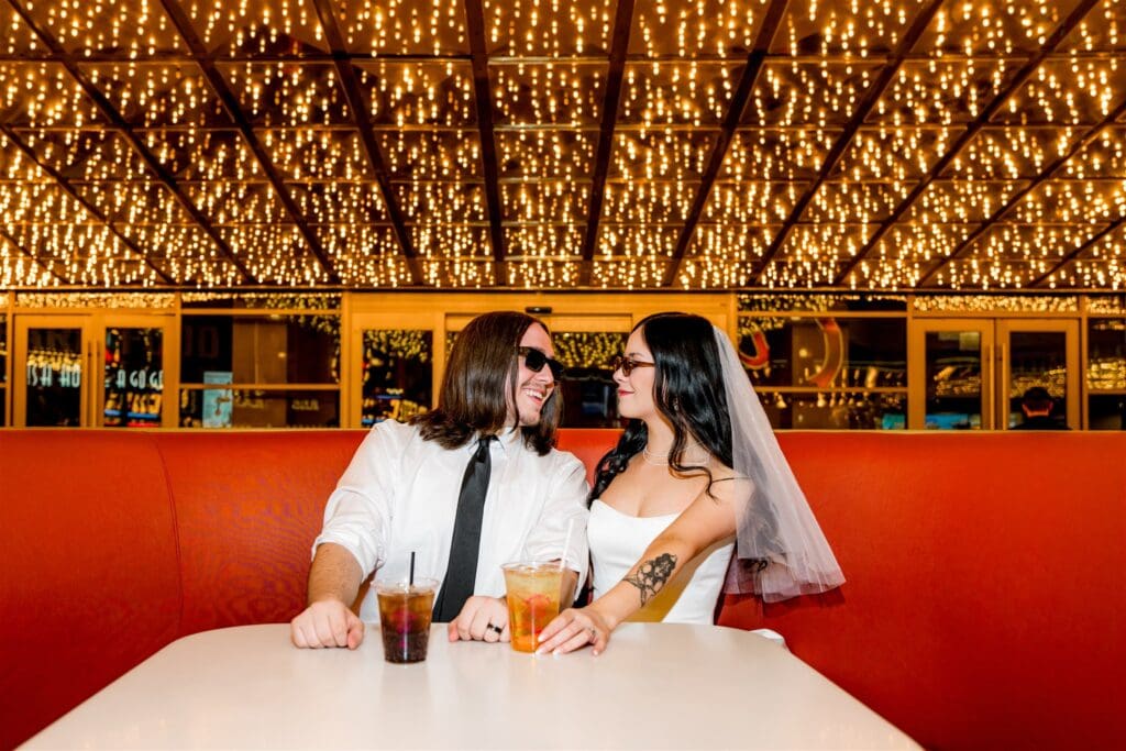 couple celebrating their elopement with drinks