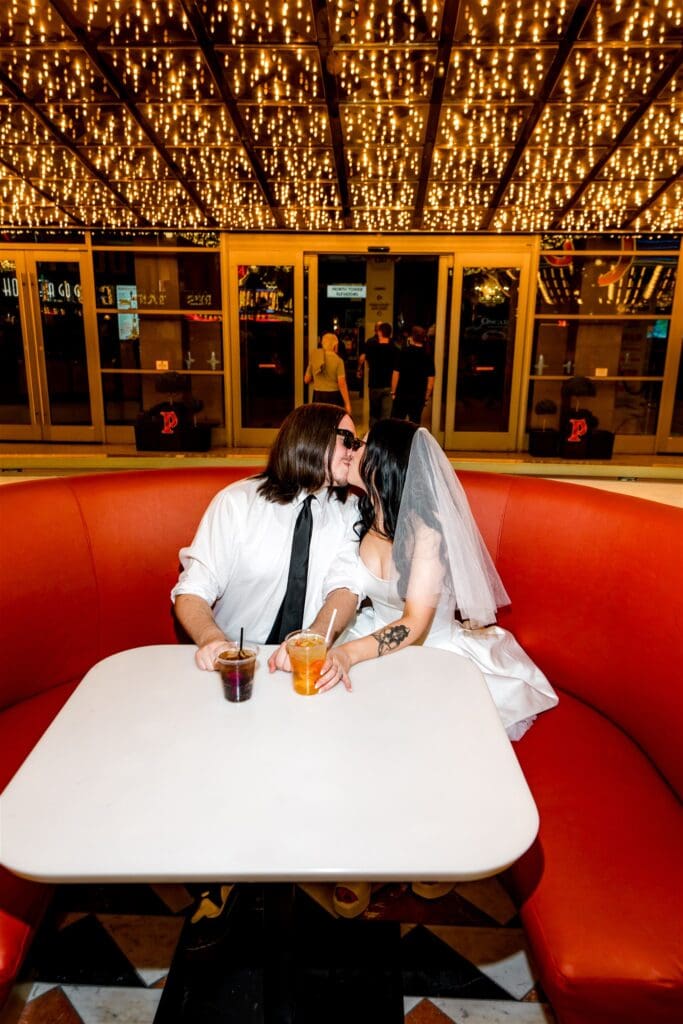 portrait of the newlyweds kissing