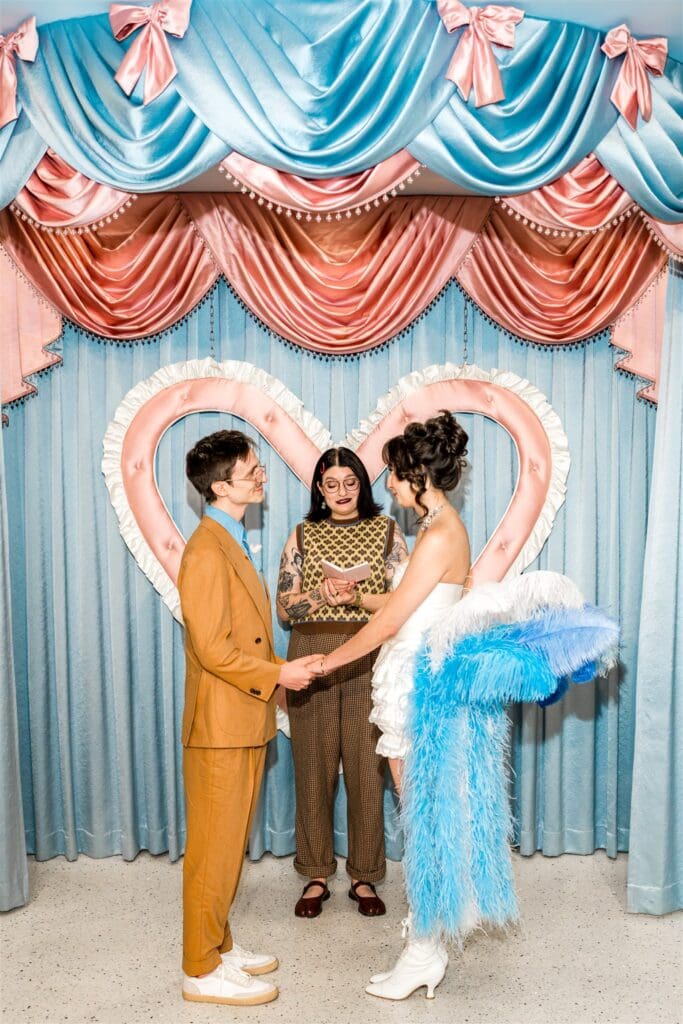bride and groom holding hands during their ceremony