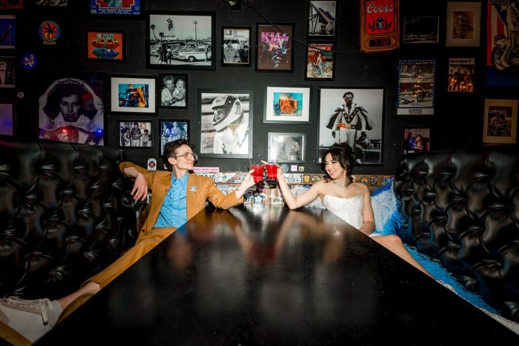 couple celebrating their elopement with drinks